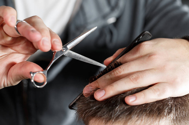 mens haircut with scissors at salon - 写真・画像