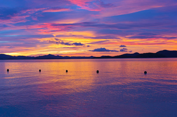 Unearthly sunset colors on a tropical island.  - Foto, afbeelding
