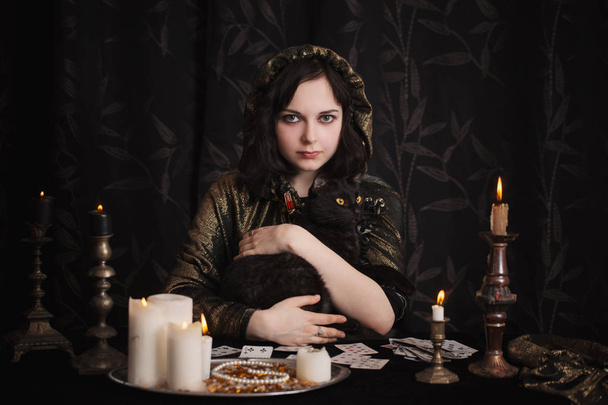 Young woman with divination cards in room - Фото, зображення