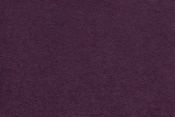 Texture of old dark purple paper closeup. Structure of a dense cardboard. The violet background. - Photo, Image