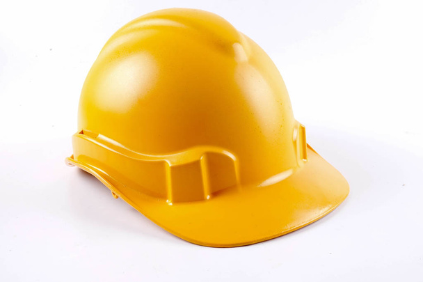 Yellow hardhat safety helmet on white background - Photo, Image