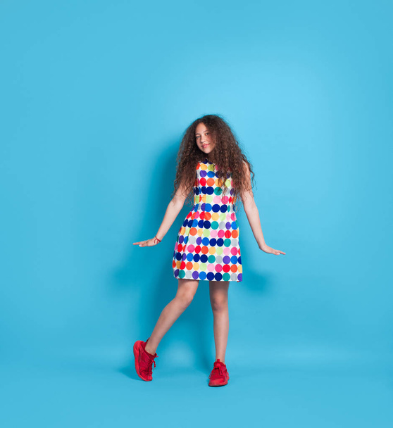Trendy hipster girl in colorful dress - Фото, изображение