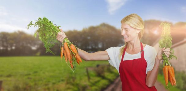 young woman holding carrot - Photo, image