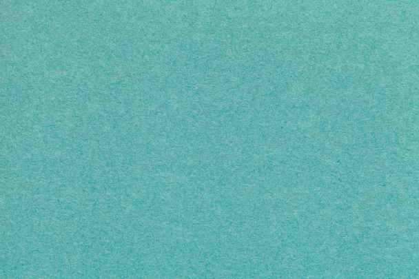 Texture of old turquoise paper closeup. Structure of a dense cardboard. The green background. - Zdjęcie, obraz
