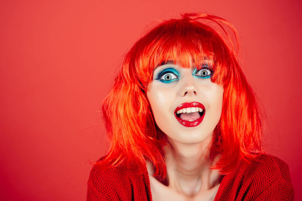 Woman in red wig with fashionable makeup. - Photo, Image