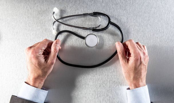 anonymous doctor hands with stethoscope for symbol of medical career - Valokuva, kuva
