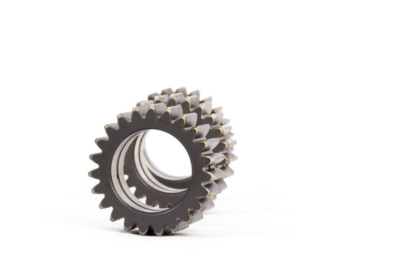 Small group of gears with their teeth engaged on a white background. - Φωτογραφία, εικόνα