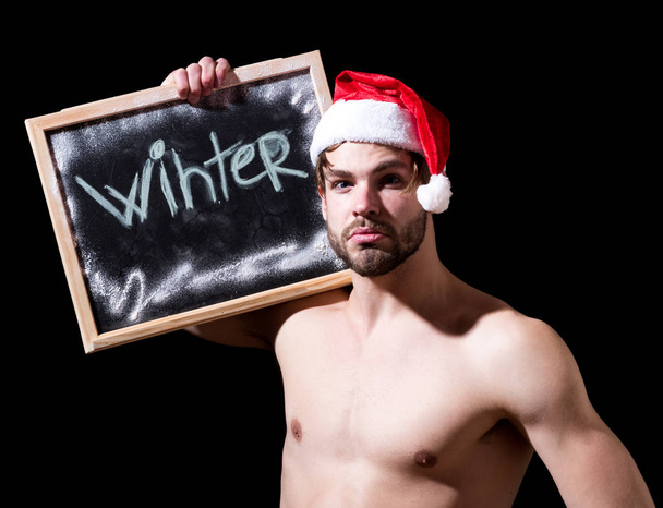 santa muscular man with winter blackboard - Φωτογραφία, εικόνα