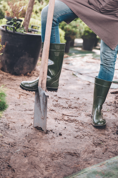 gardener in rubber boots with spade - Photo, Image