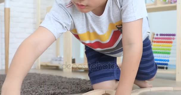 Happy asian cute boy playing wood train toy at home . - Video