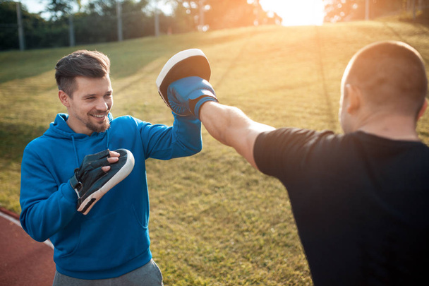 punching exercises with personal coach; - Foto, Bild