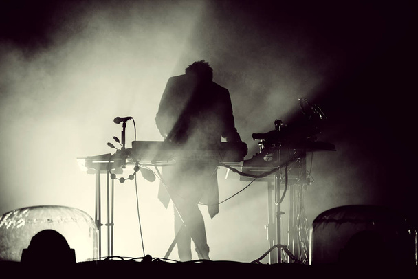 Silhouette of a keyboardist in stage lights - Fotografie, Obrázek