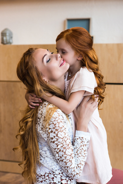 happy mother and daughter hugging  - Фото, зображення