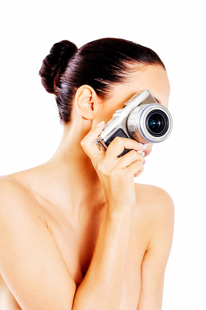 Nude beautiful woman with photo camera. - Фото, изображение