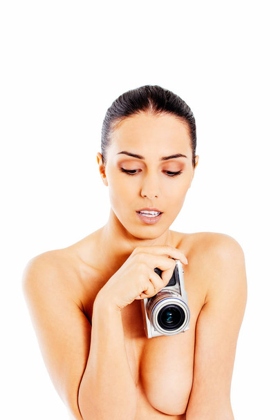 Nude beautiful woman with photo camera. - Valokuva, kuva