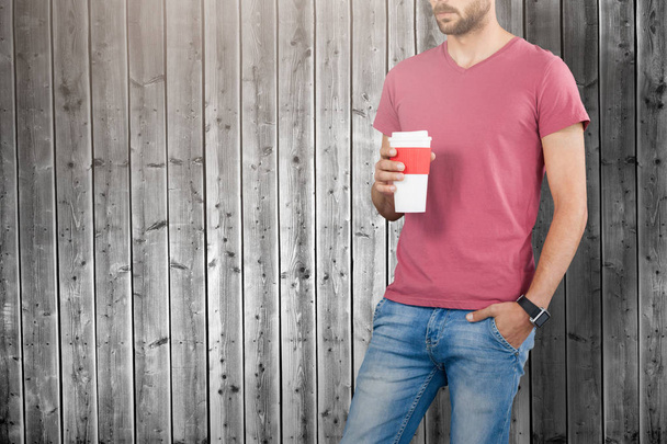 male model holding disposable cup - Foto, Bild