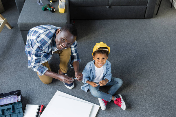 african-american father and son doing renovation - Photo, Image