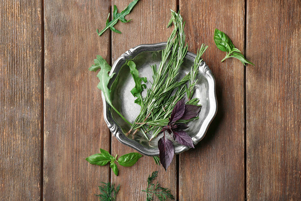 plate with rosemary and basil - 写真・画像
