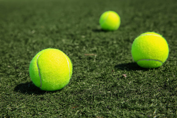 Tennis balls on grass  - 写真・画像