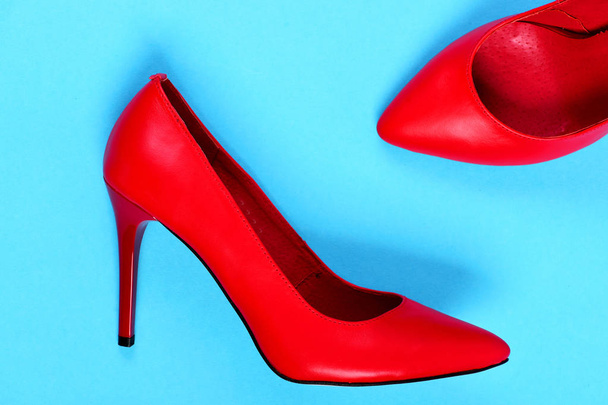 Fancy high heel red shoes isolated on blue background - Foto, Imagem