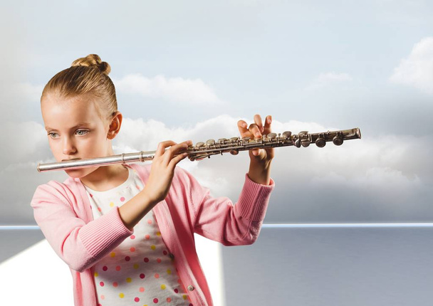 Girl playing flute  - Foto, afbeelding
