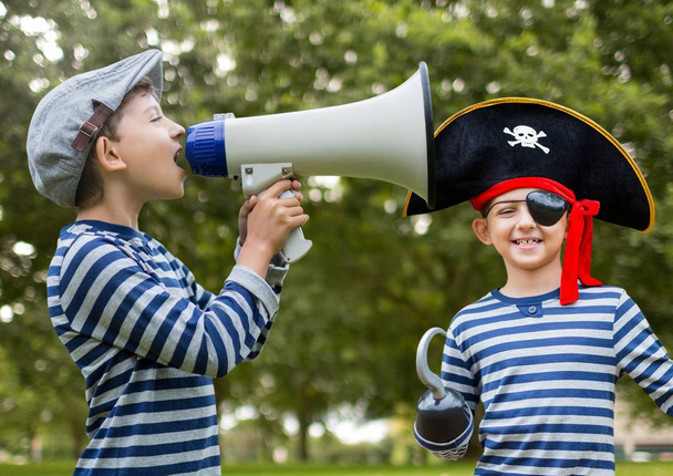 Boy holding megaphone and pirate - Foto, Imagem