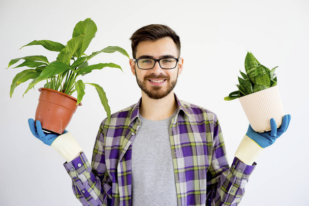 Male gardener with plants - Фото, изображение