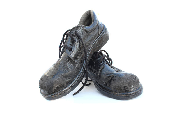 Zapatos de seguridad viejos en aislado
 - Foto, Imagen