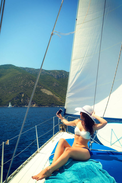 Woman on a sailing boat in the Ionian sea - Fotó, kép