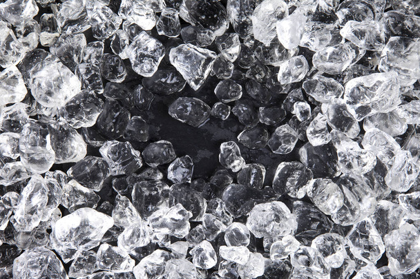 Crushed ice on black background - Foto, afbeelding