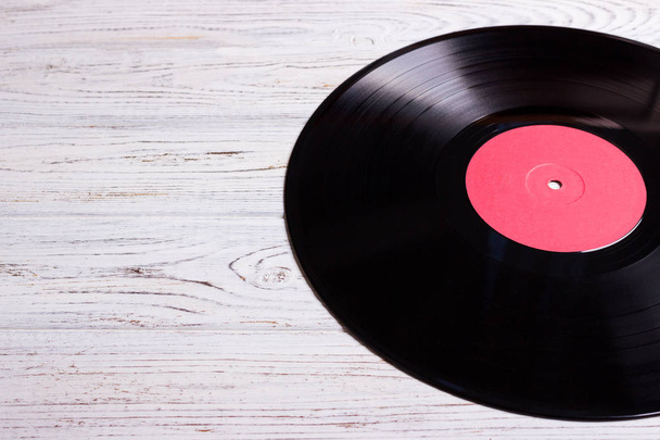 vinyl disc isolated on the wooden table - Photo, Image