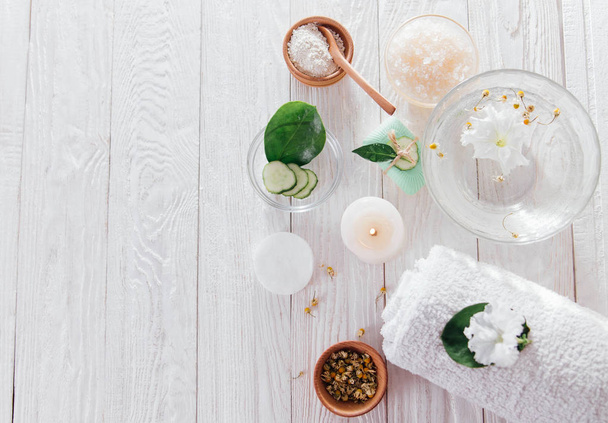 Spa essentials including candle, salt, herbs and white clay - Photo, Image