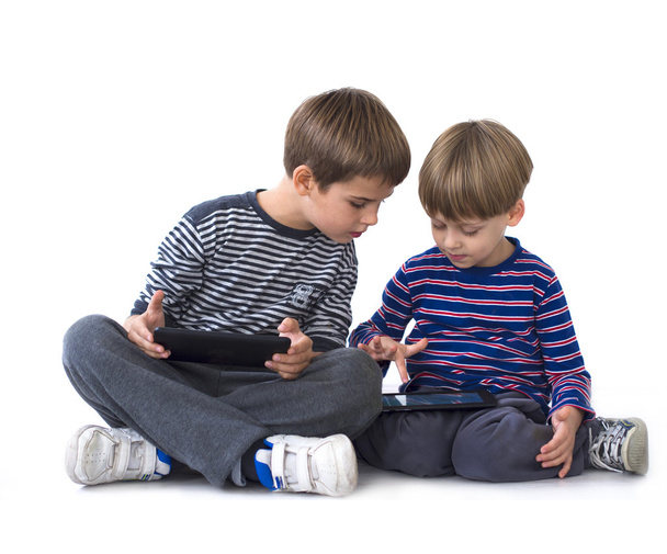 Kids playing video games on tablets computers - Foto, Imagem