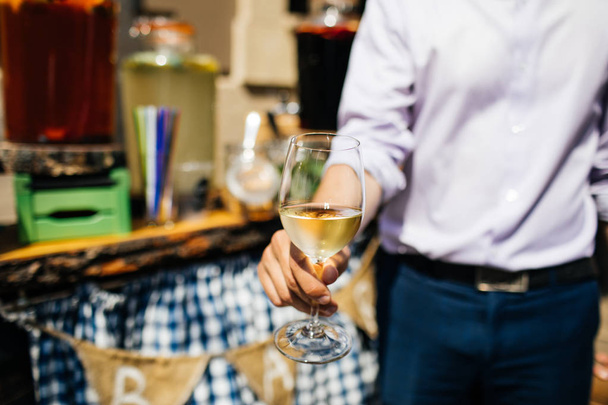 Man with a glass of white wine - Photo, Image