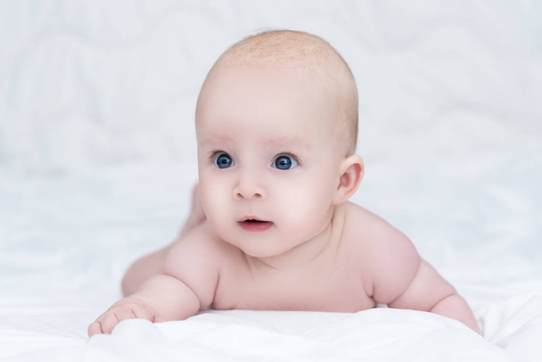 portrait of adorable baby girl with blue eyes - Fotó, kép