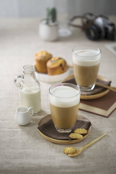 Latte coffee with milk foam topping - 写真・画像