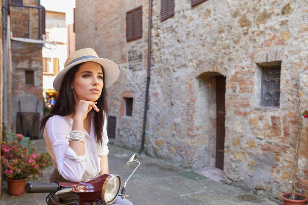 Italian woman on a scooter   - Фото, зображення