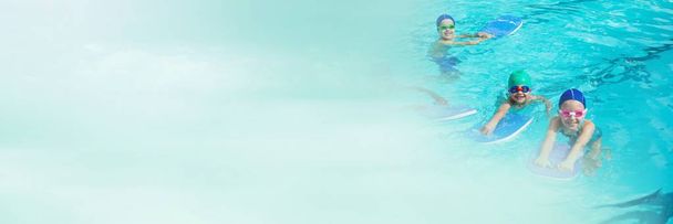 Children learning to swim in Swimming pool  - Valokuva, kuva
