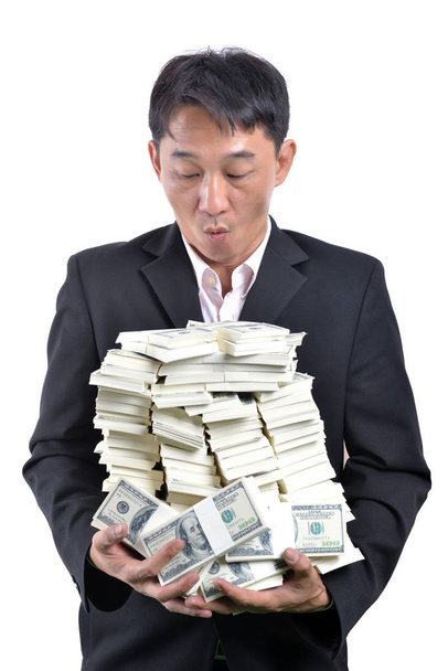 A lot of money in the hands of a young businessman. - Photo, image