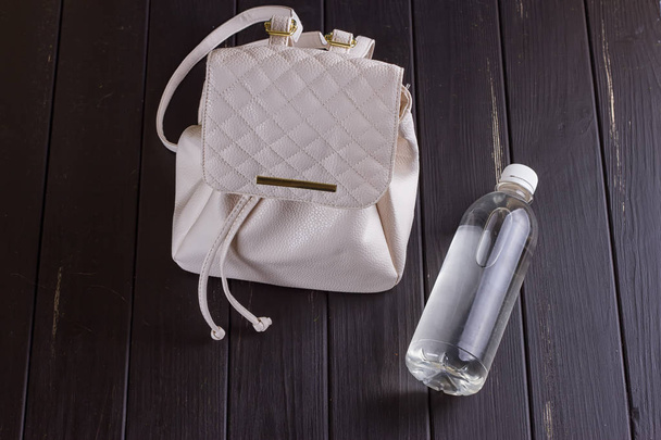 White leather backpack and water bottle - Photo, Image