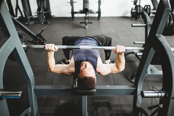 Man exercising at gym - Фото, зображення