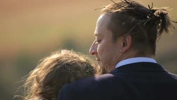 Portrait couples, tenderness love. beautiful young couple on the background meadows - Felvétel, videó