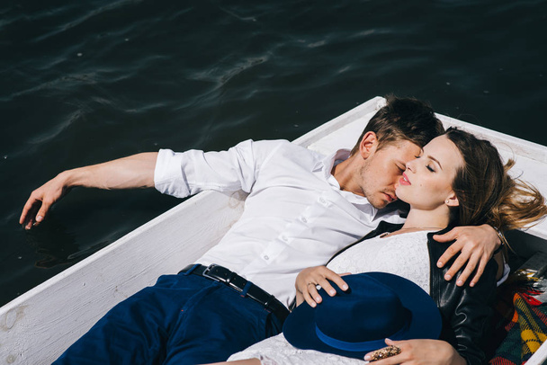 Lovely couple in boat on lake - Photo, Image