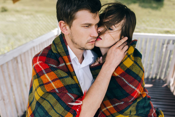 woman and man wrapped in blanket  hugging  - Photo, Image