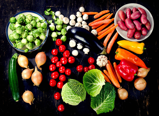Organic vegetables on dark wooden table. - Fotografie, Obrázek