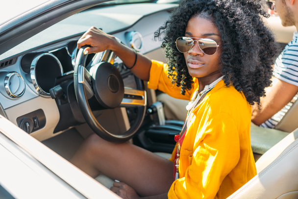 african american woman riding car - 写真・画像