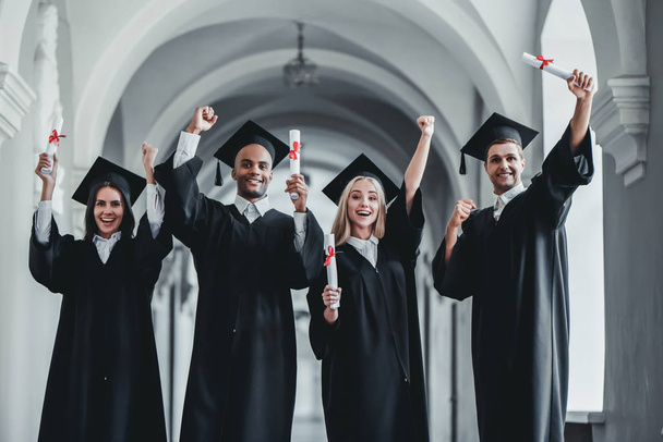 Graduates in university - Foto, Imagen