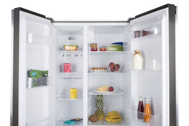 Open fridge full of fresh fruits and vegetables - Foto, imagen
