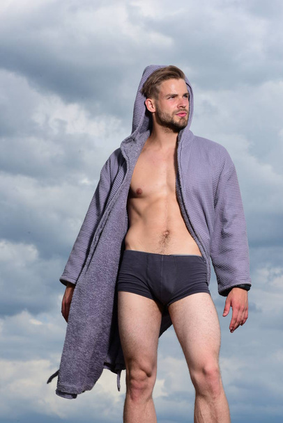 Adult handsome man in fashionable bathrobe. - Фото, изображение