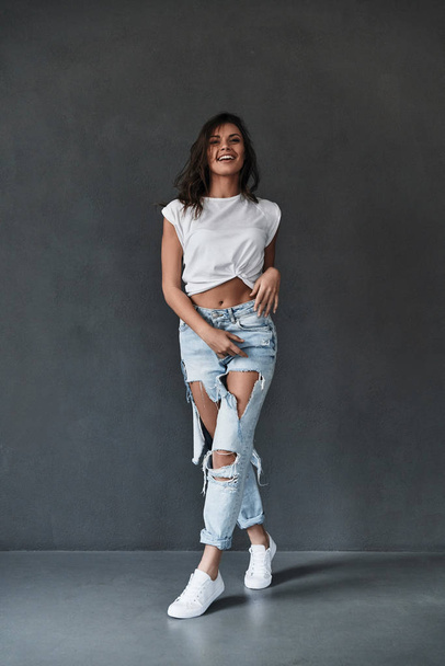 brunette woman in ripped jeans - Photo, image